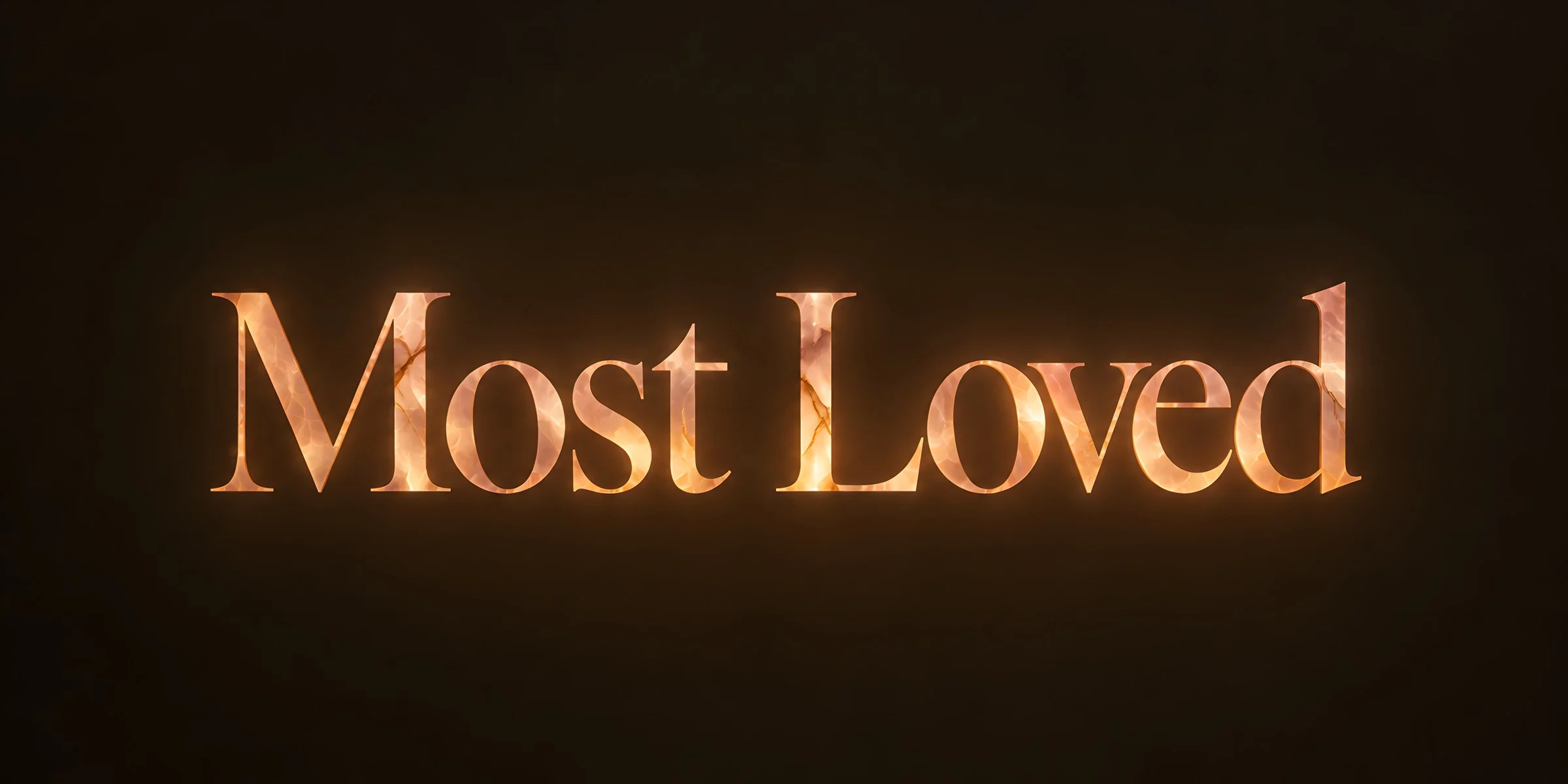 “Most Loved” in glowing rose and amber onyx lettering