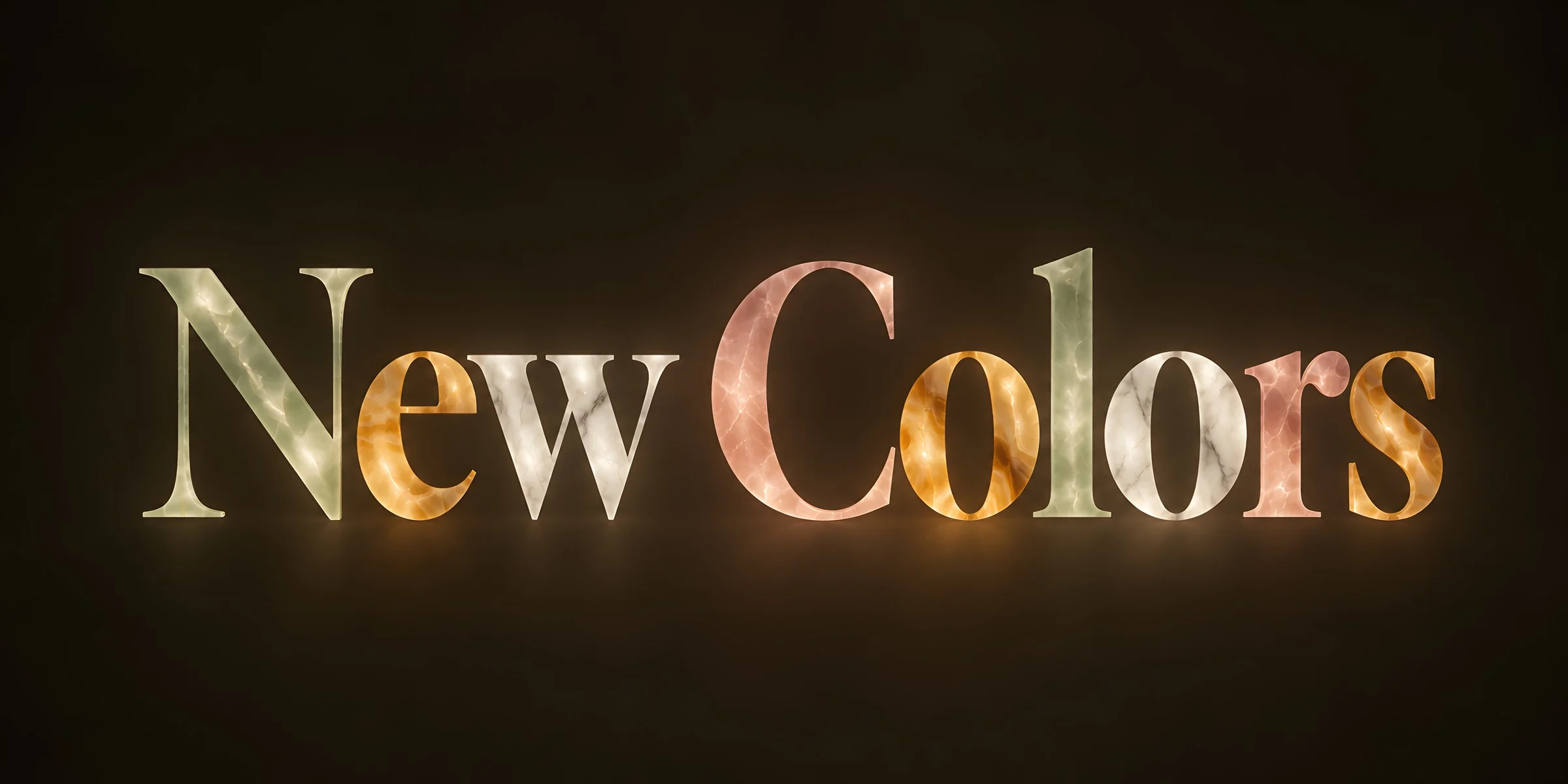 “New Colors” in lettering made of different translucent stones