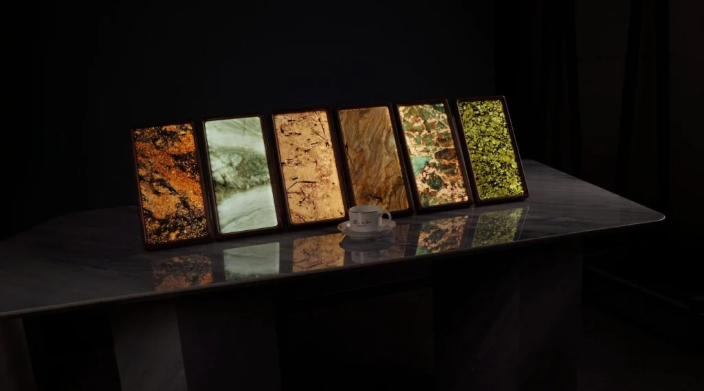 A row of glowing stone and wood lamps on a dark table